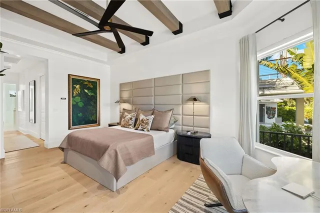 a kitchen with sink cabinets and living room view