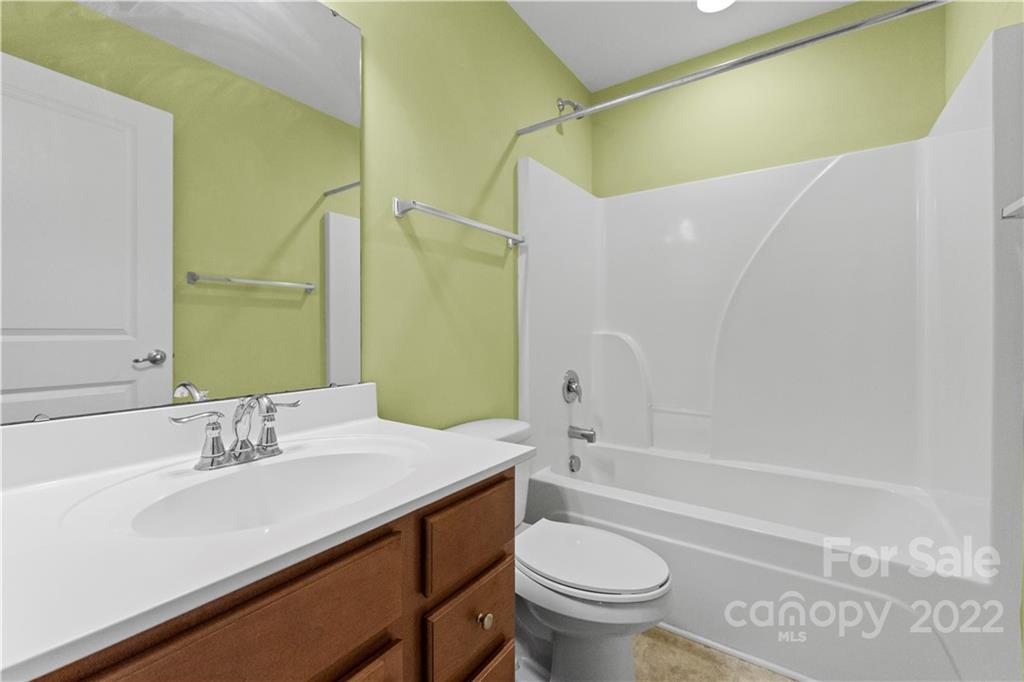 7720 East Berkeley Road Denver, NC 28037 - Photo 24 of 40 a bathroom with a sink a toilet and a bathtub
