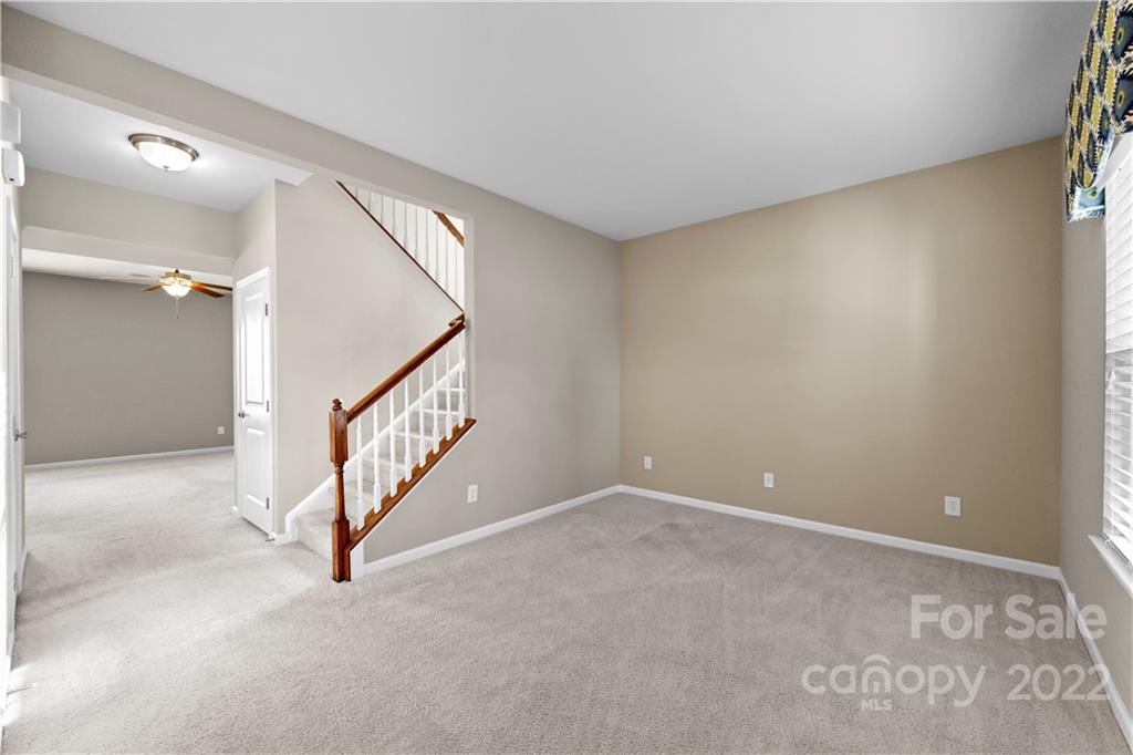 7720 East Berkeley Road Denver, NC 28037 - Photo 3 of 40 a view of an empty room with stairs