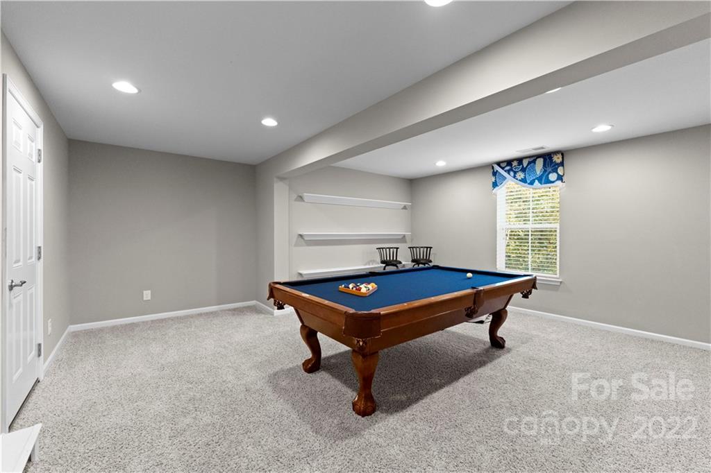 7720 East Berkeley Road Denver, NC 28037 - Photo 34 of 40 a room with pool table and windows