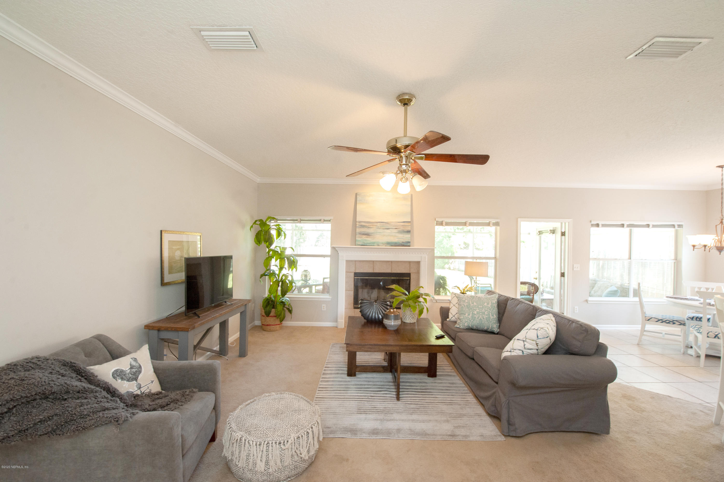 446 Big Tree Road Ponte Vedra Beach, FL 32082 - Photo 11 of 21 a living room with furniture and a fireplace