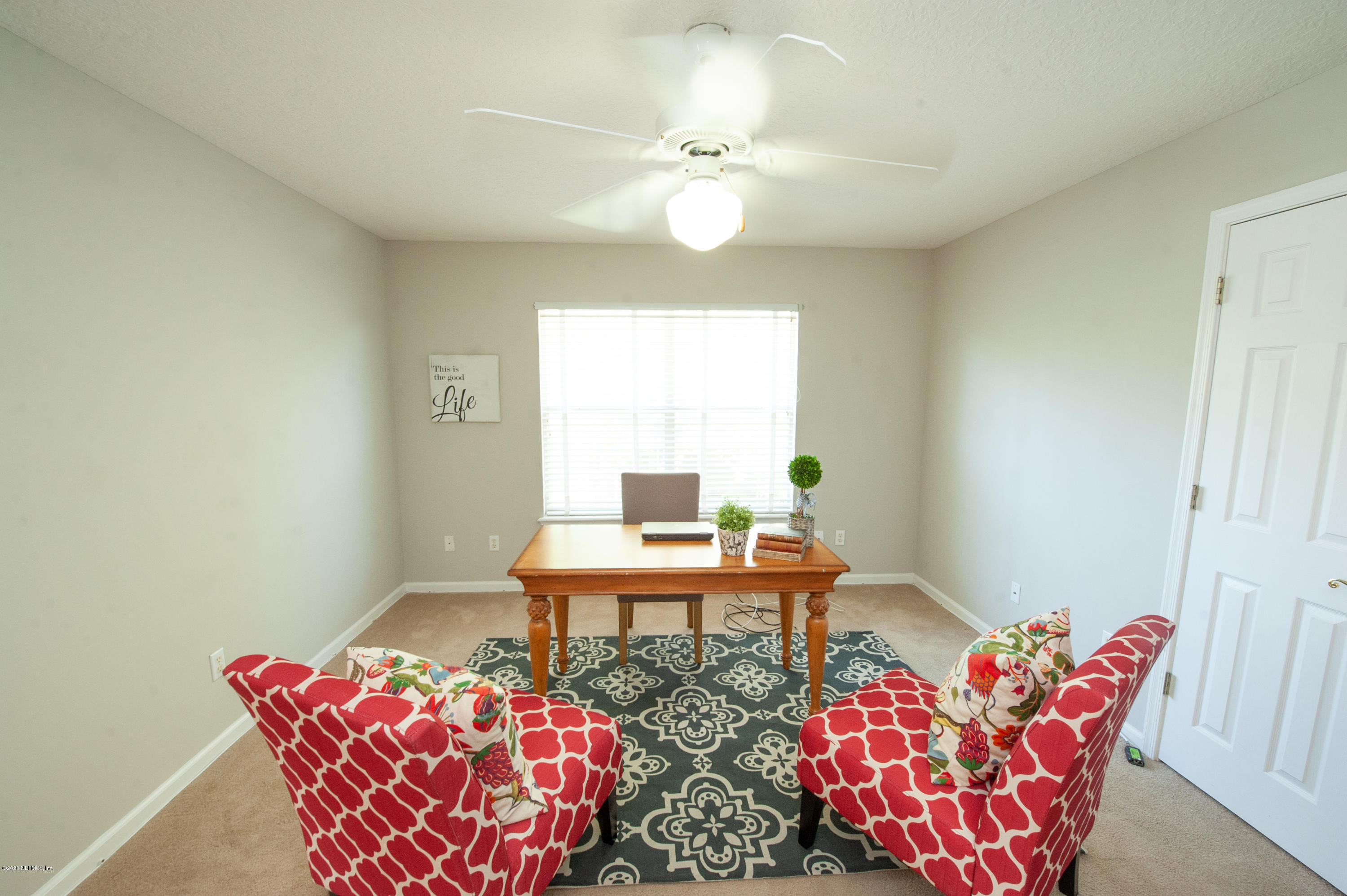 446 Big Tree Road Ponte Vedra Beach, FL 32082 - Photo 12 of 21 a living room with furniture and a chandelier