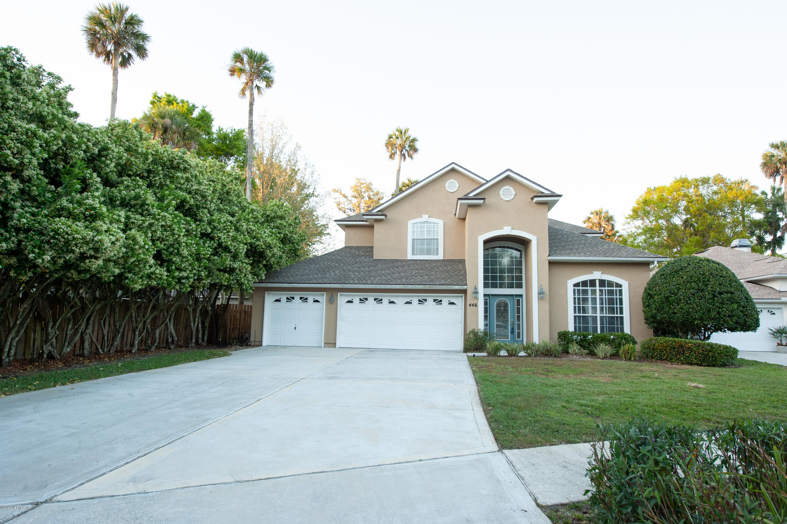 446 Big Tree Road Ponte Vedra Beach, FL 32082 - Photo 2 of 21 a front view of a house with a yard and garage