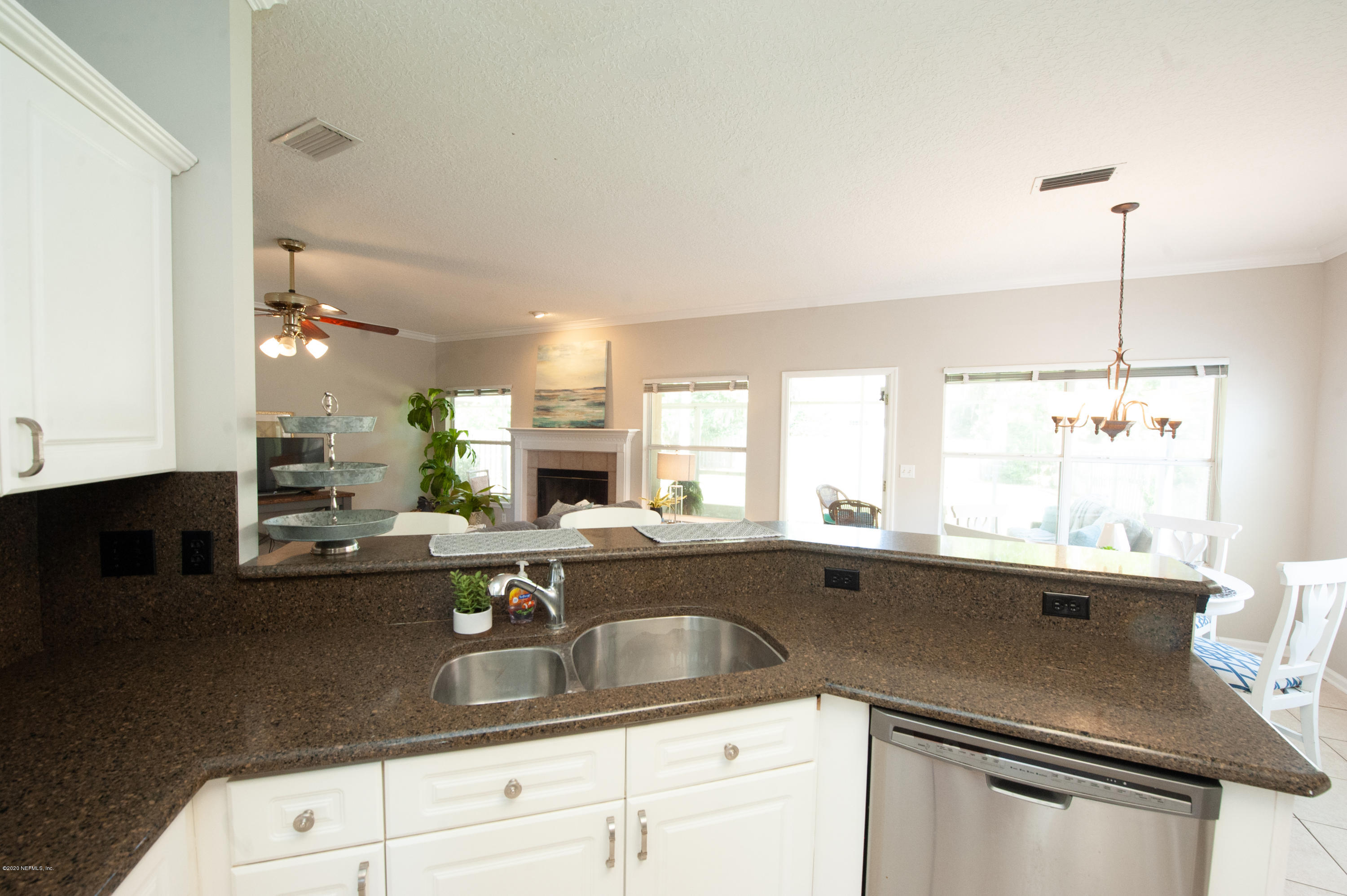 446 Big Tree Road Ponte Vedra Beach, FL 32082 - Photo 7 of 21 a kitchen with a sink a counter and appliances