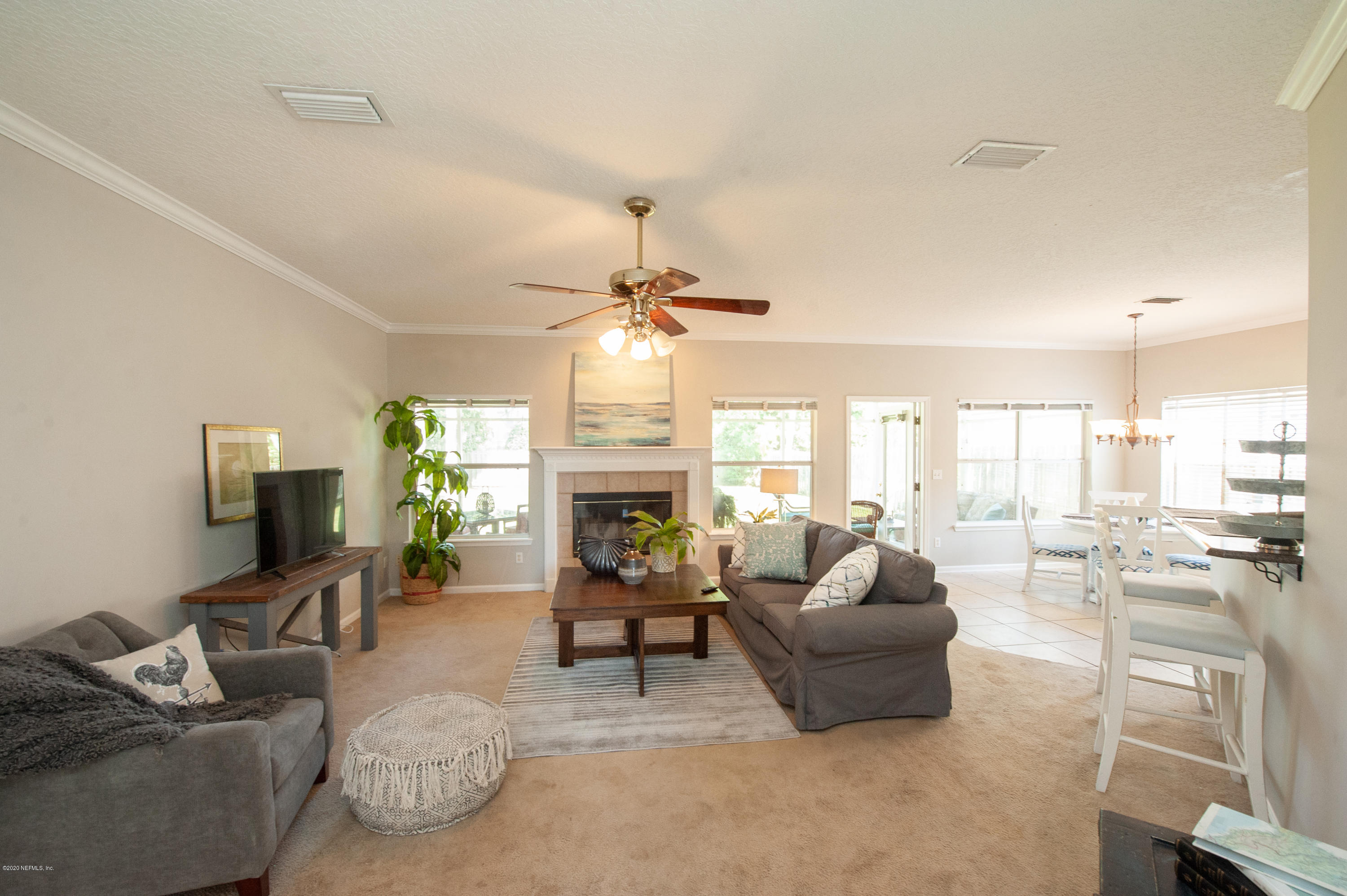 446 Big Tree Road Ponte Vedra Beach, FL 32082 - Photo 10 of 21 a living room with furniture and a fireplace
