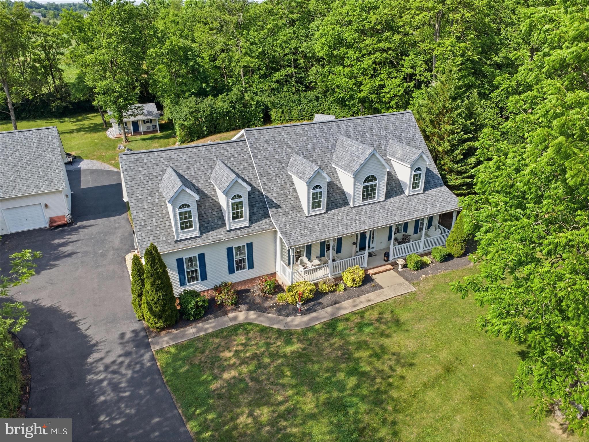 726 Doe Run Road Inwood, WV 25428 - Photo 6 of 68 an aerial view of a house with swimming pool and garden