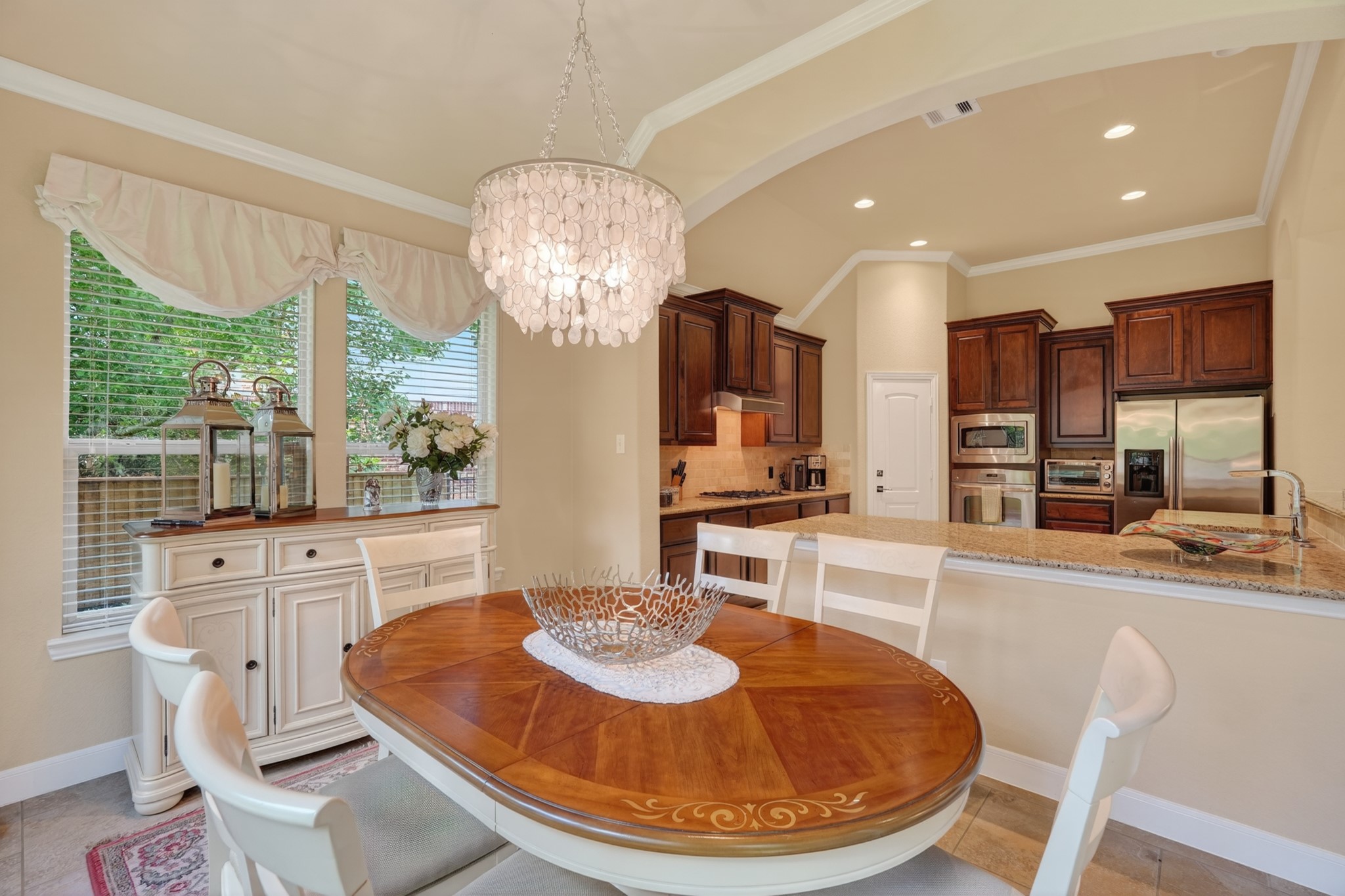 55 South Victoriana Circle Spring, TX 77389 - Photo 20 of 40 a large kitchen with furniture and a chandelier