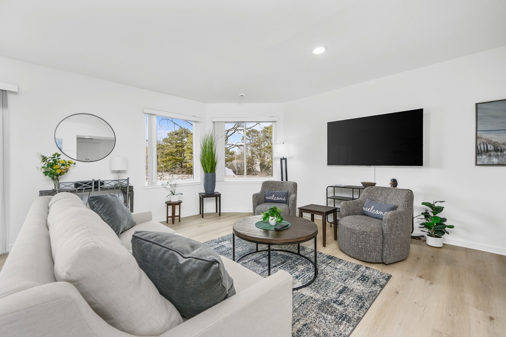 1 Belmont Road, Unit 425 West Harwich, MA 02671 - Photo 5 of 27 a living room with furniture and a flat screen tv