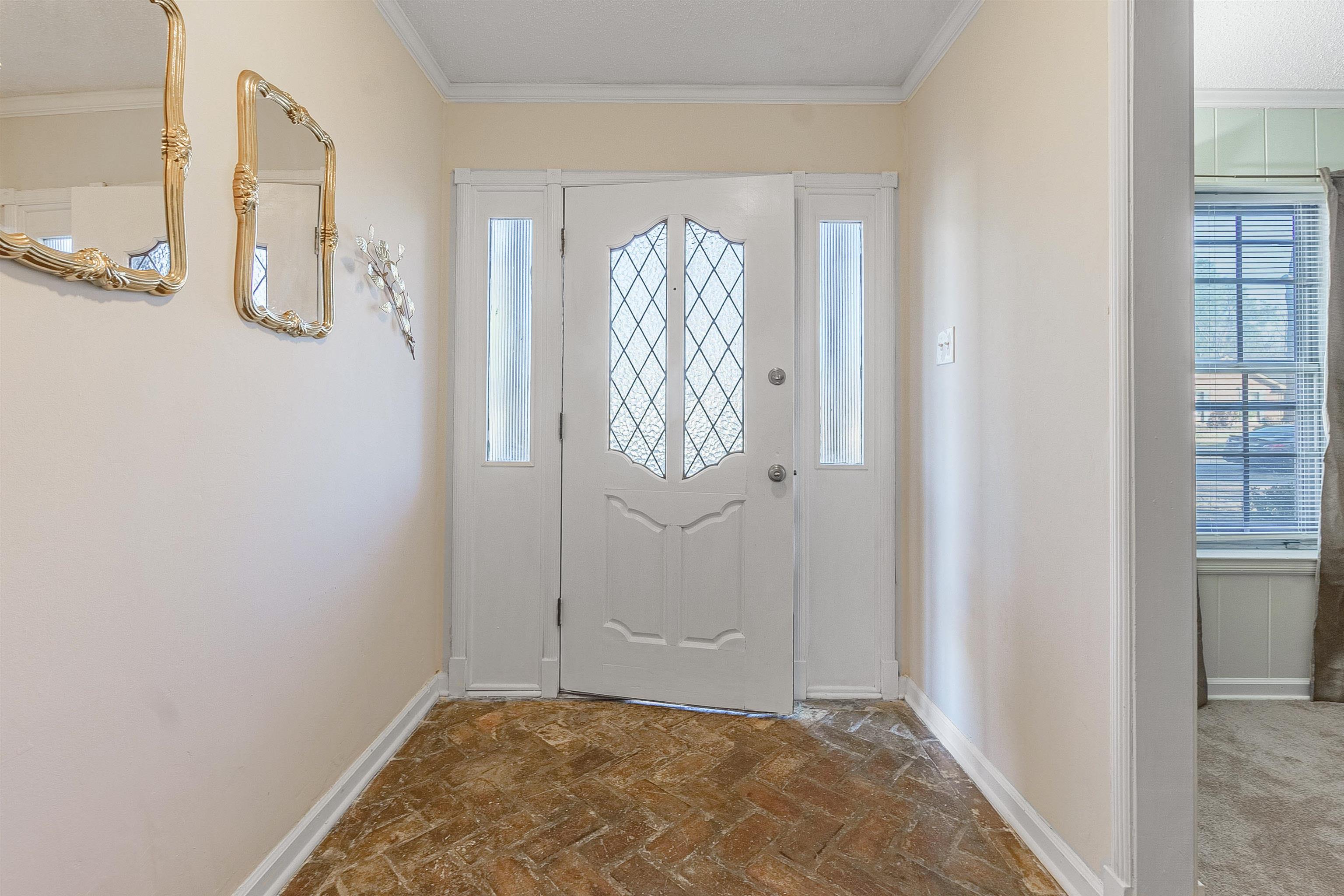 3467 Fox Meadows Road Memphis, TN 38115 - Photo 3 of 15 Foyer entrance featuring ornamental molding