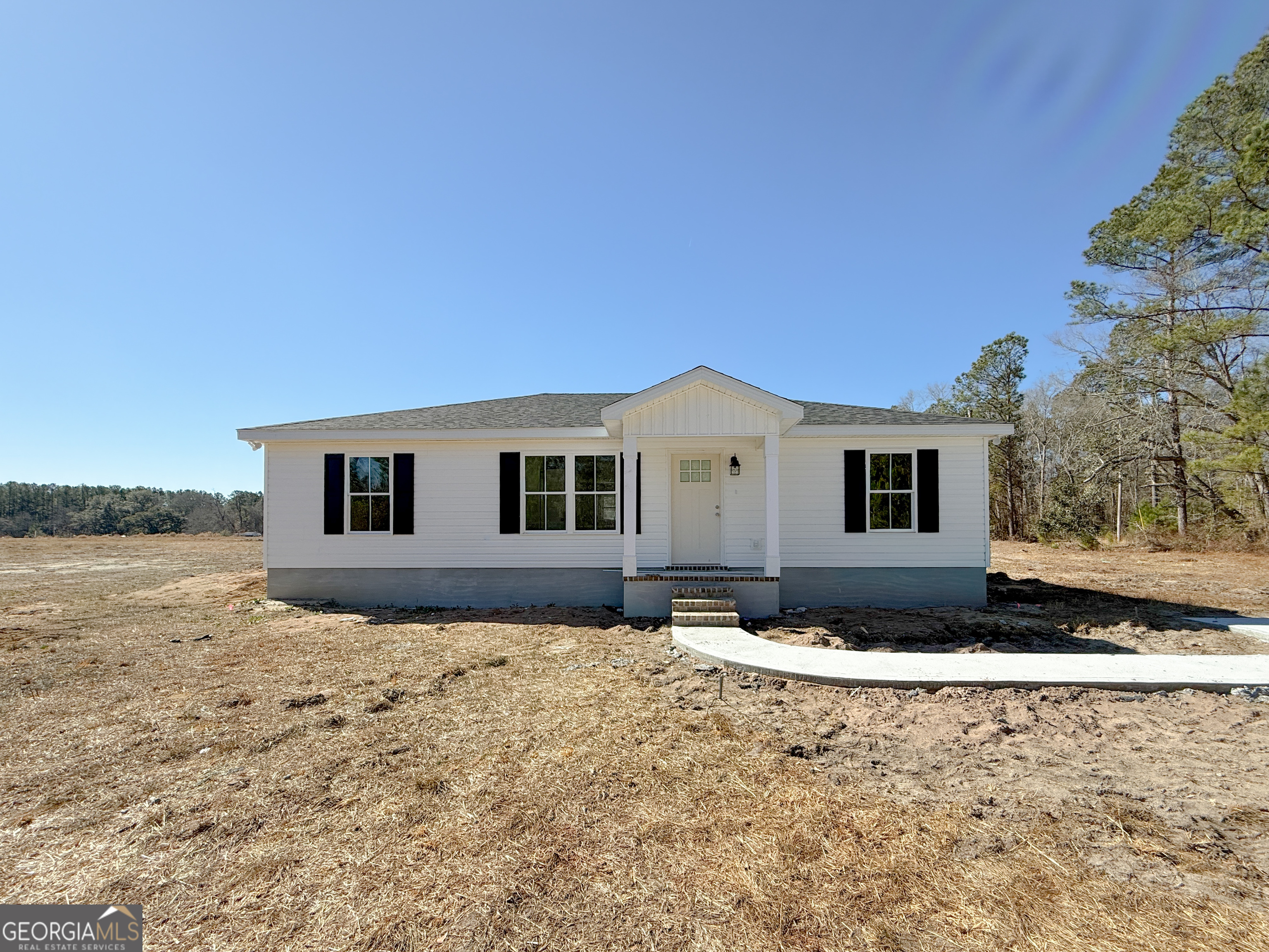 4348 Deloach Church Road Claxton, GA 30417 - Photo 1 of 25 a view of a house with a yard