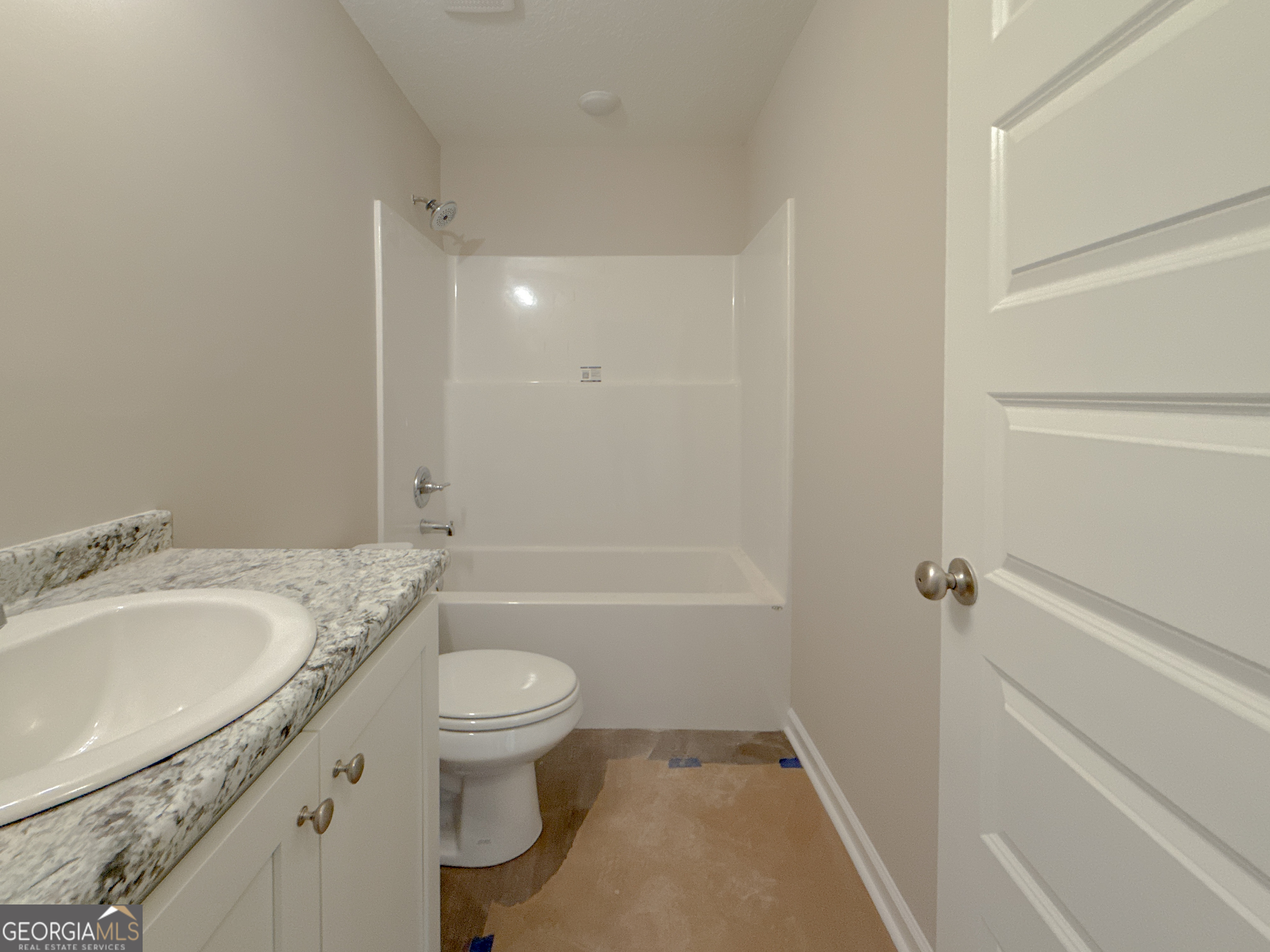 4348 Deloach Church Road Claxton, GA 30417 - Photo 18 of 25 a bathroom with a granite countertop sink a toilet and shower