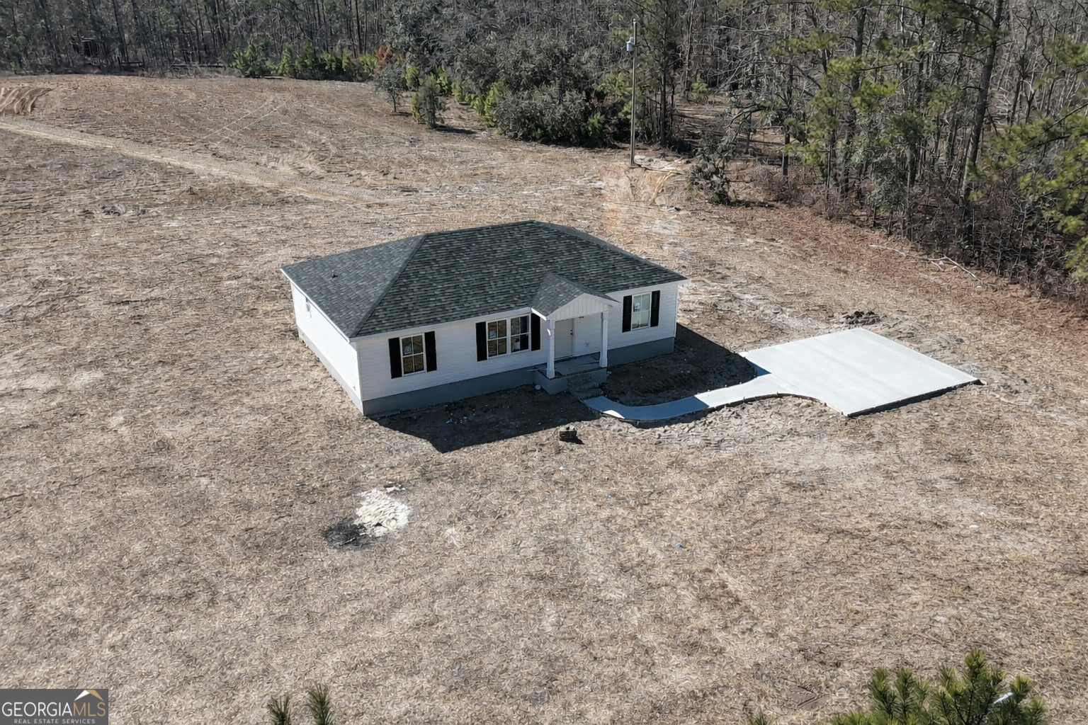 4348 Deloach Church Road Claxton, GA 30417 - Photo 23 of 25 a view of a wooden house with a yard