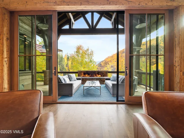 a balcony with furniture and a potted plant