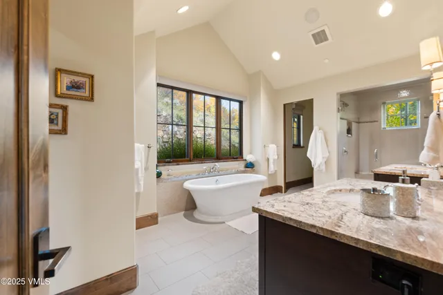 a bedroom with a bed and a lamp