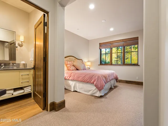 an aerial view of a house with swimming pool and garden