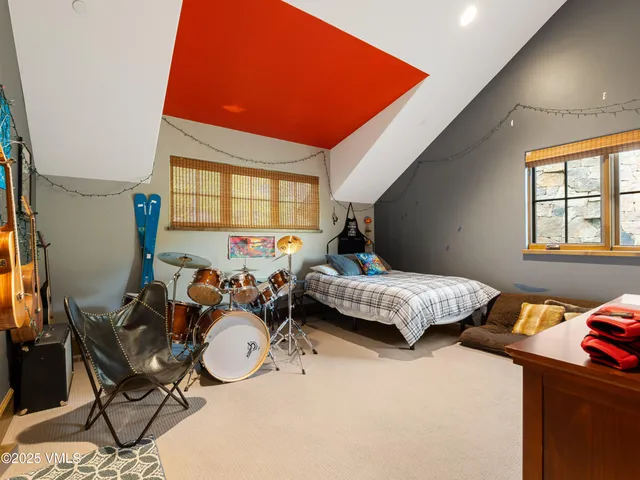 a aerial view of a house with swimming pool and next to a yard