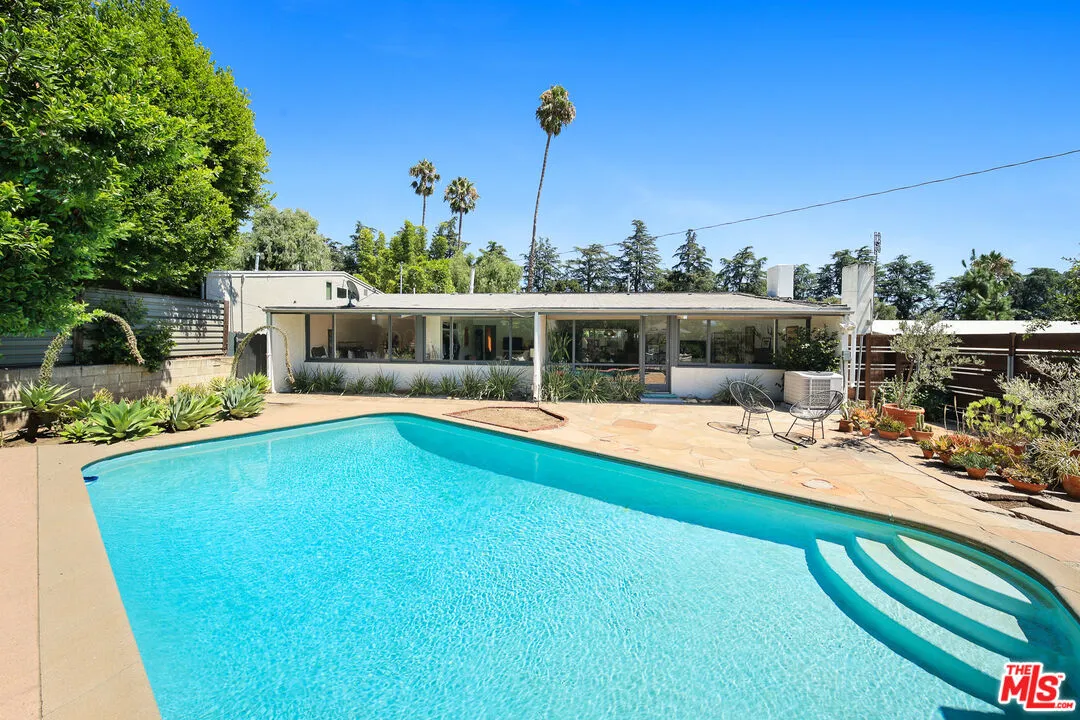 a view of a swimming pool with a patio