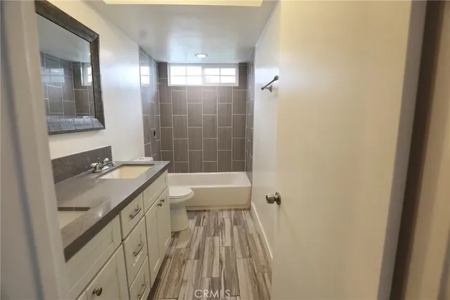 a bathroom with a sink a mirror and a bathtub