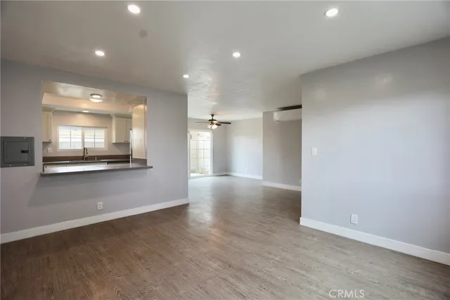 a view of a kitchen with a stove and a refrigerator