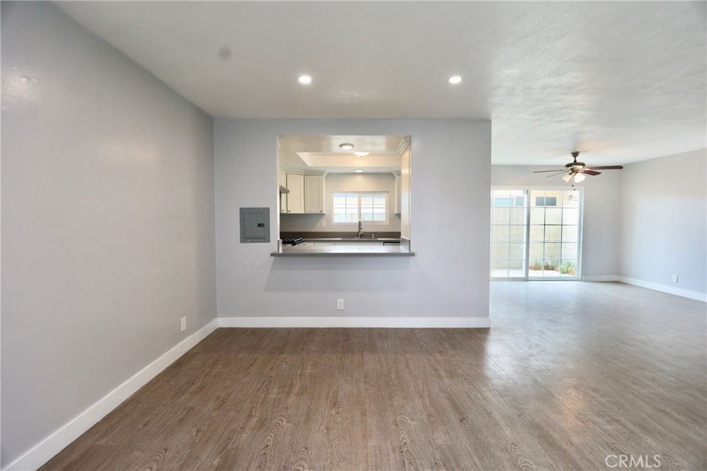 1745 East Woodbury Road Pasadena, CA 91104 - Photo 10 of 18 wooden floor in an empty room with a window
