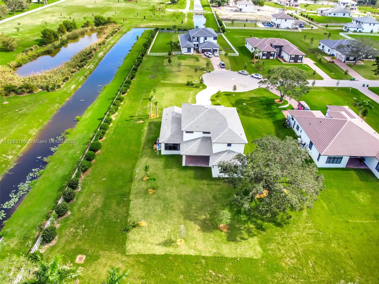 4795 Southwest 159th Avenue Southwest Ranches, FL 33331 - Photo 30 of 35 an aerial view of residential houses with outdoor space and street view