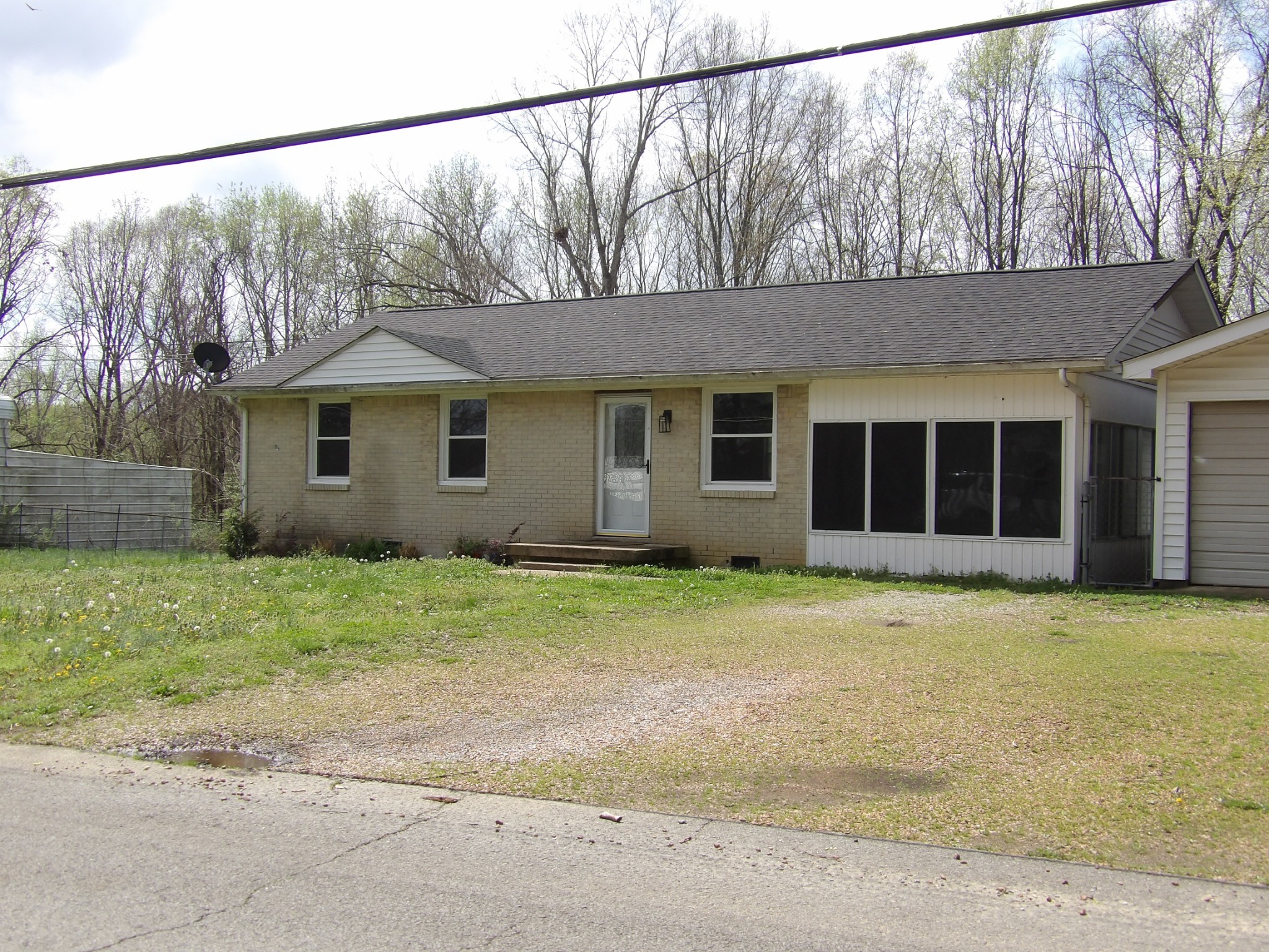 457 East Little Richland Road Waverly, TN 37185 - Photo 14 of 47 a house with a tree in the background