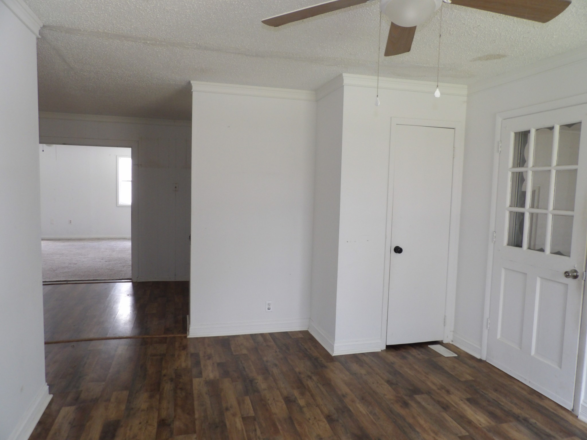 457 East Little Richland Road Waverly, TN 37185 - Photo 20 of 47 an empty room with wooden floor and windows