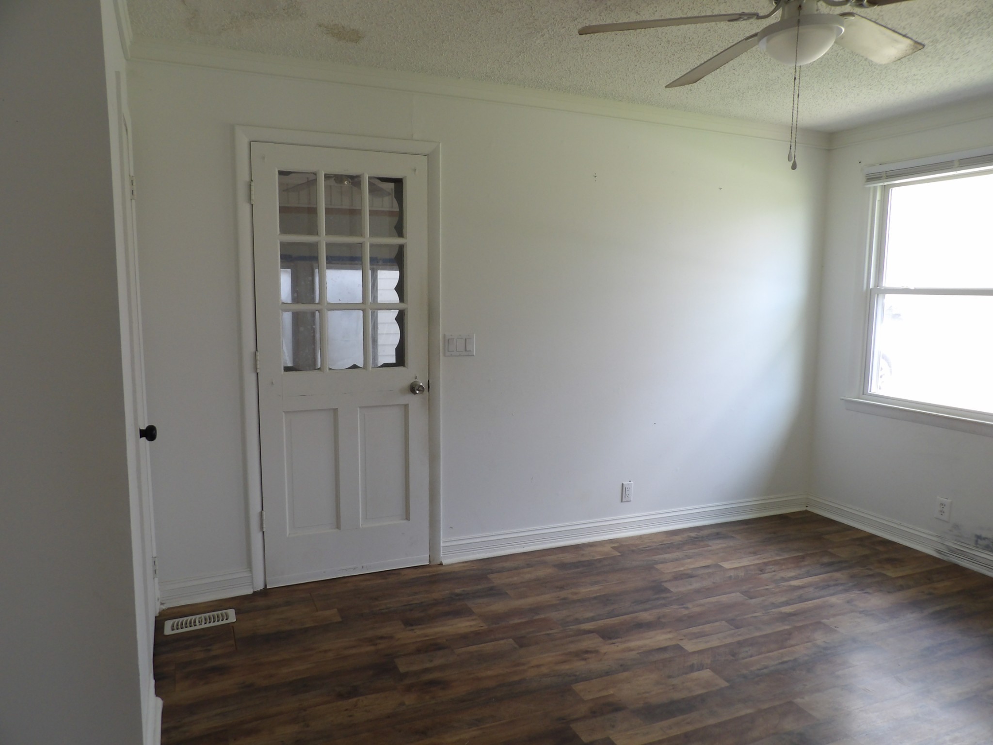 457 East Little Richland Road Waverly, TN 37185 - Photo 21 of 47 an empty room with wooden floor and windows