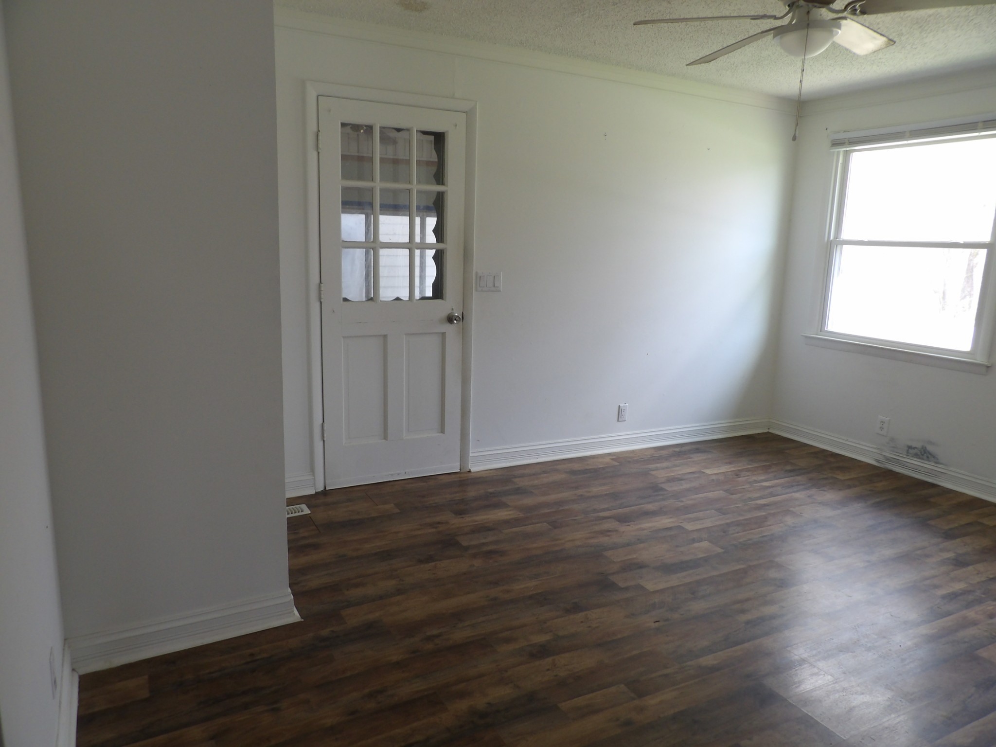 457 East Little Richland Road Waverly, TN 37185 - Photo 22 of 47 an empty room with wooden floor and windows