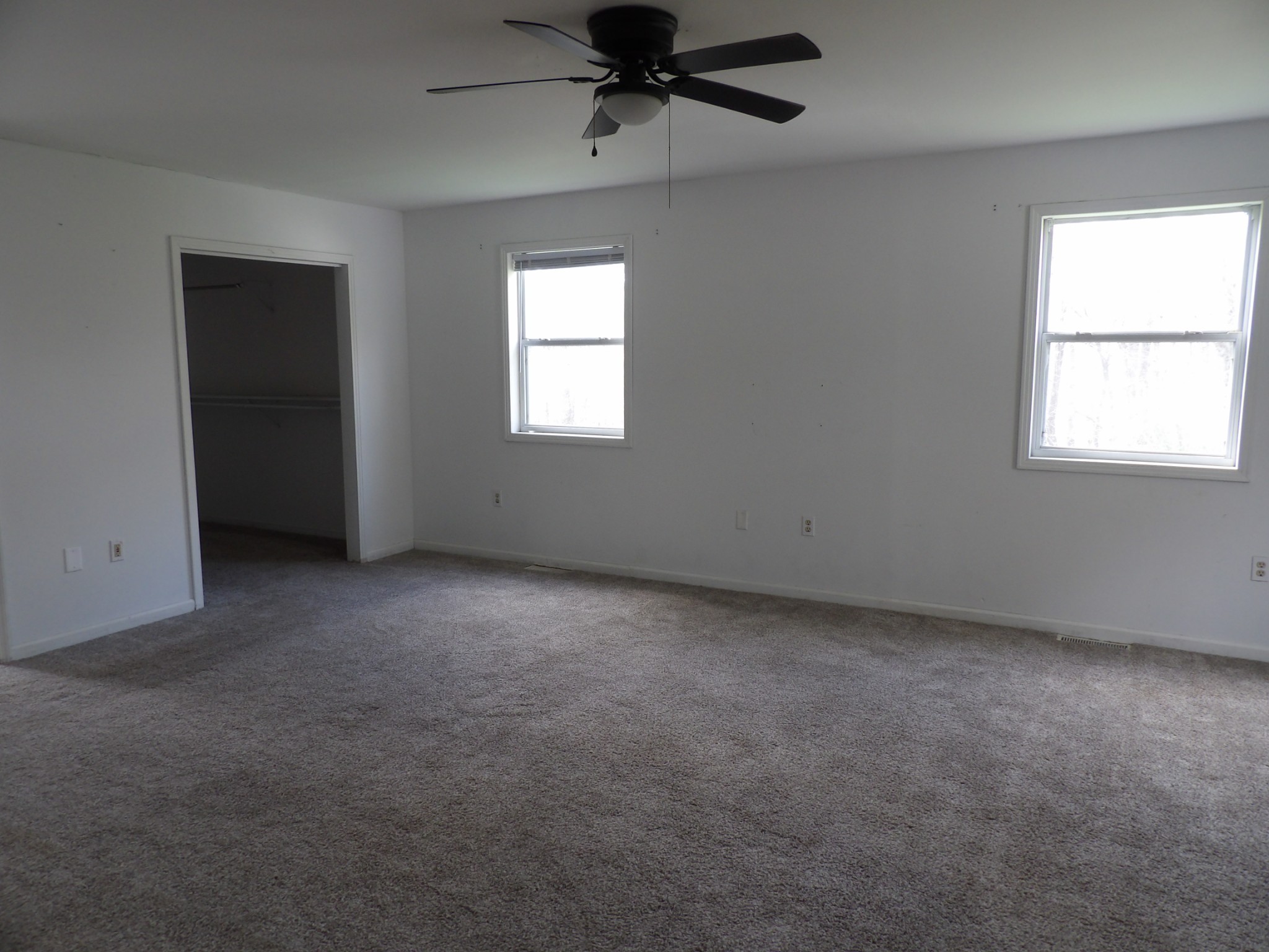457 East Little Richland Road Waverly, TN 37185 - Photo 26 of 47 an empty room with a window and a fan