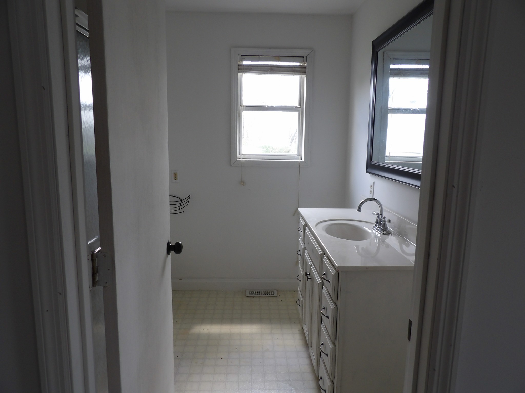 457 East Little Richland Road Waverly, TN 37185 - Photo 27 of 47 a bathroom with a sink toilet and window