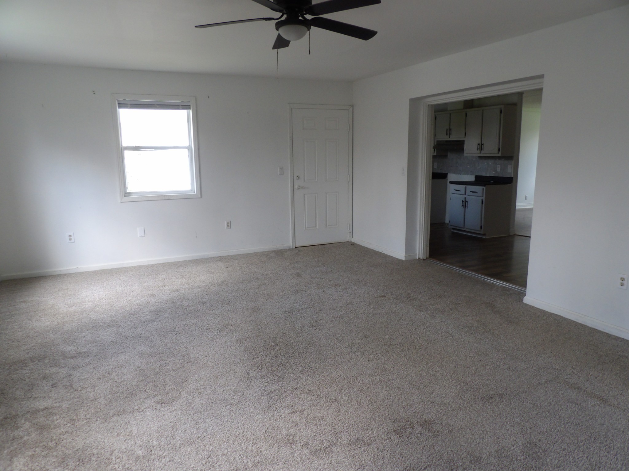 457 East Little Richland Road Waverly, TN 37185 - Photo 32 of 47 an empty room with a window and stainless steel appliances