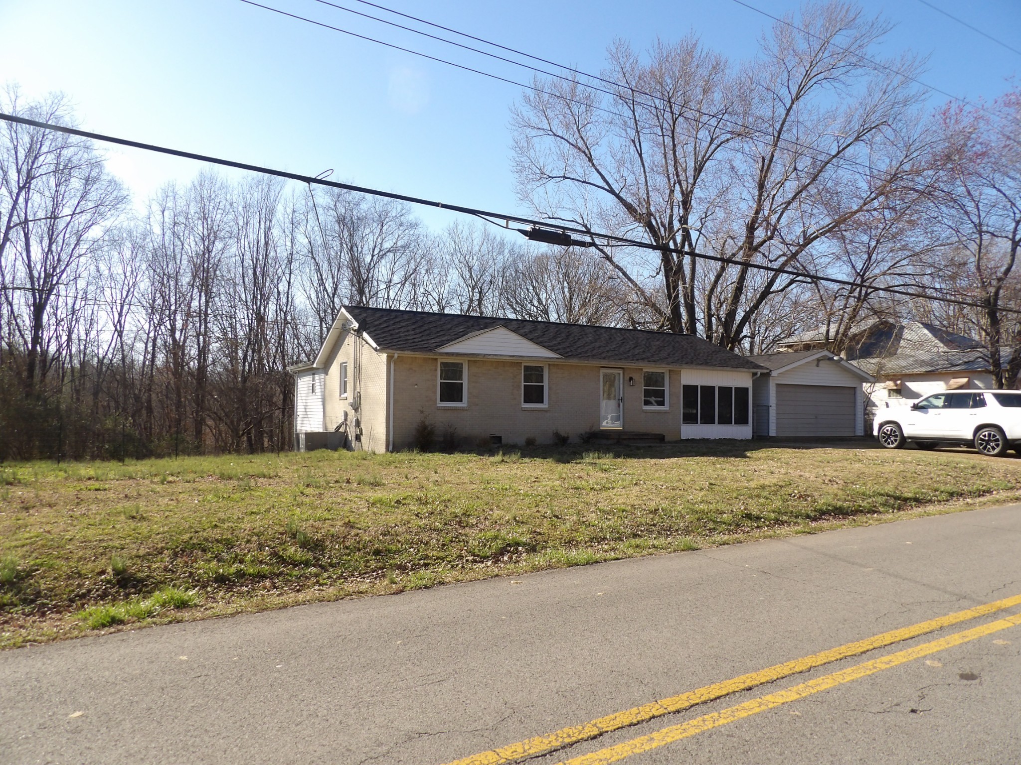 457 East Little Richland Road Waverly, TN 37185 - Photo 4 of 47 a house with trees in the background