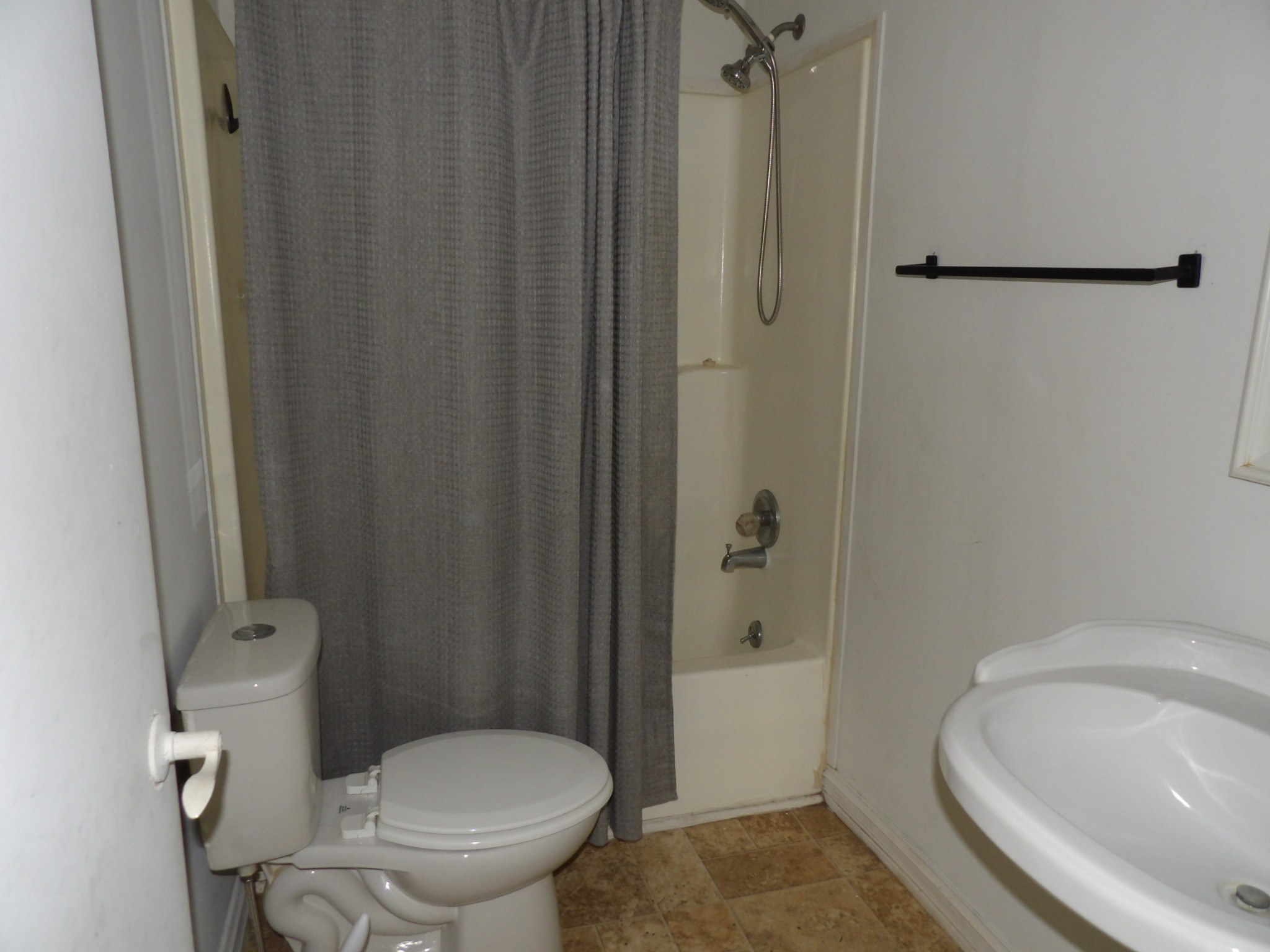 457 East Little Richland Road Waverly, TN 37185 - Photo 43 of 47 a white toilet sitting next to a bathroom sink