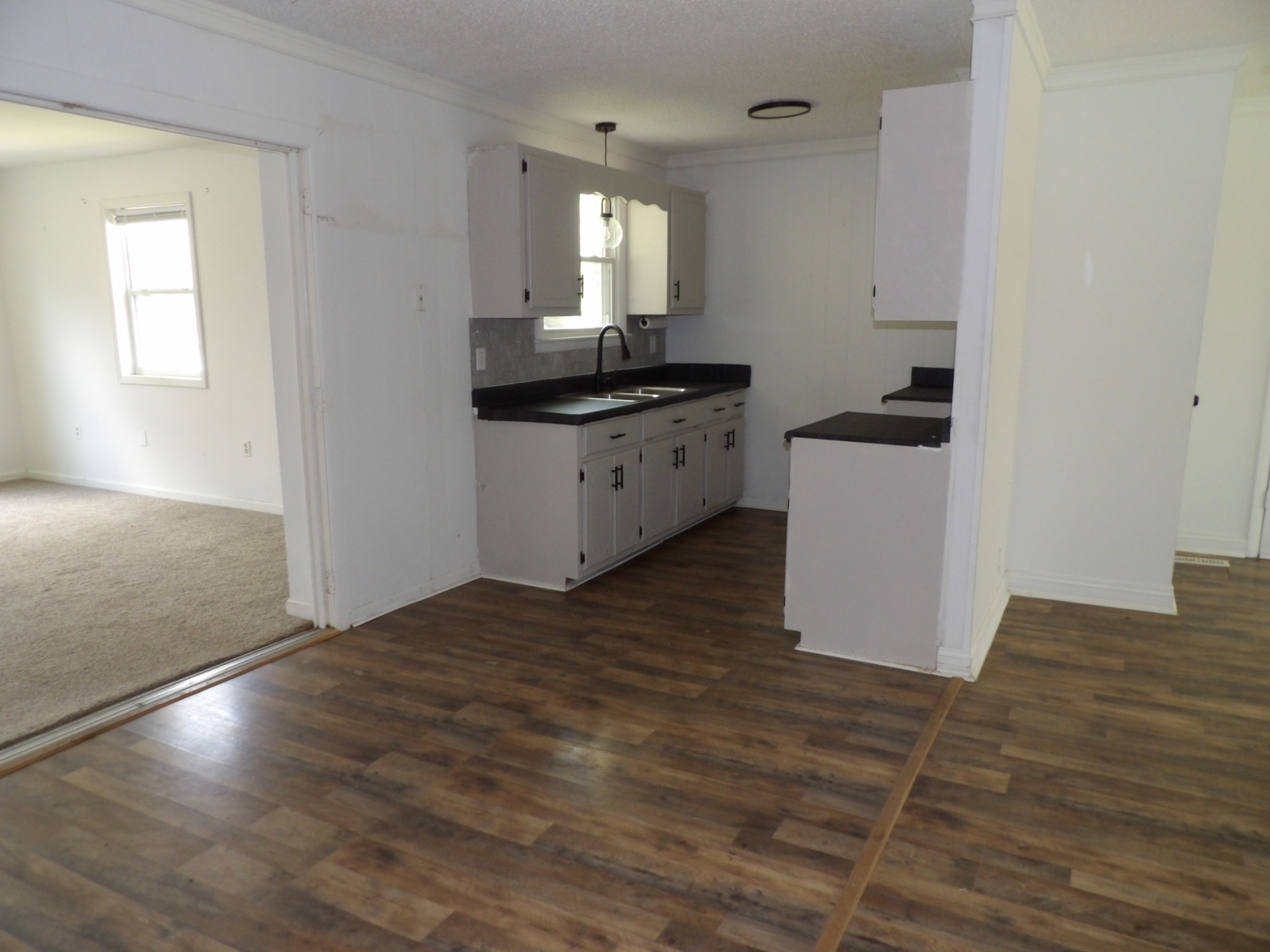457 East Little Richland Road Waverly, TN 37185 - Photo 44 of 47 a kitchen with granite countertop a sink and a stove top oven