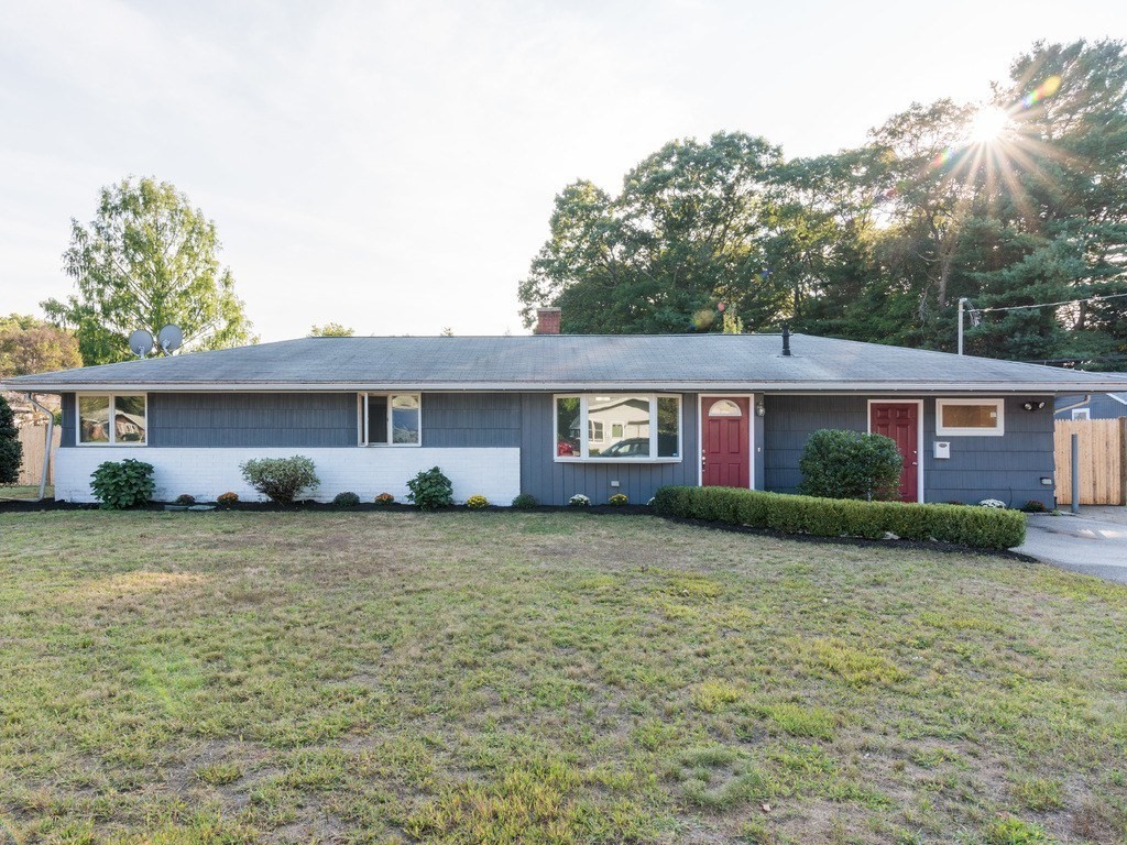 a front view of a house with a yard