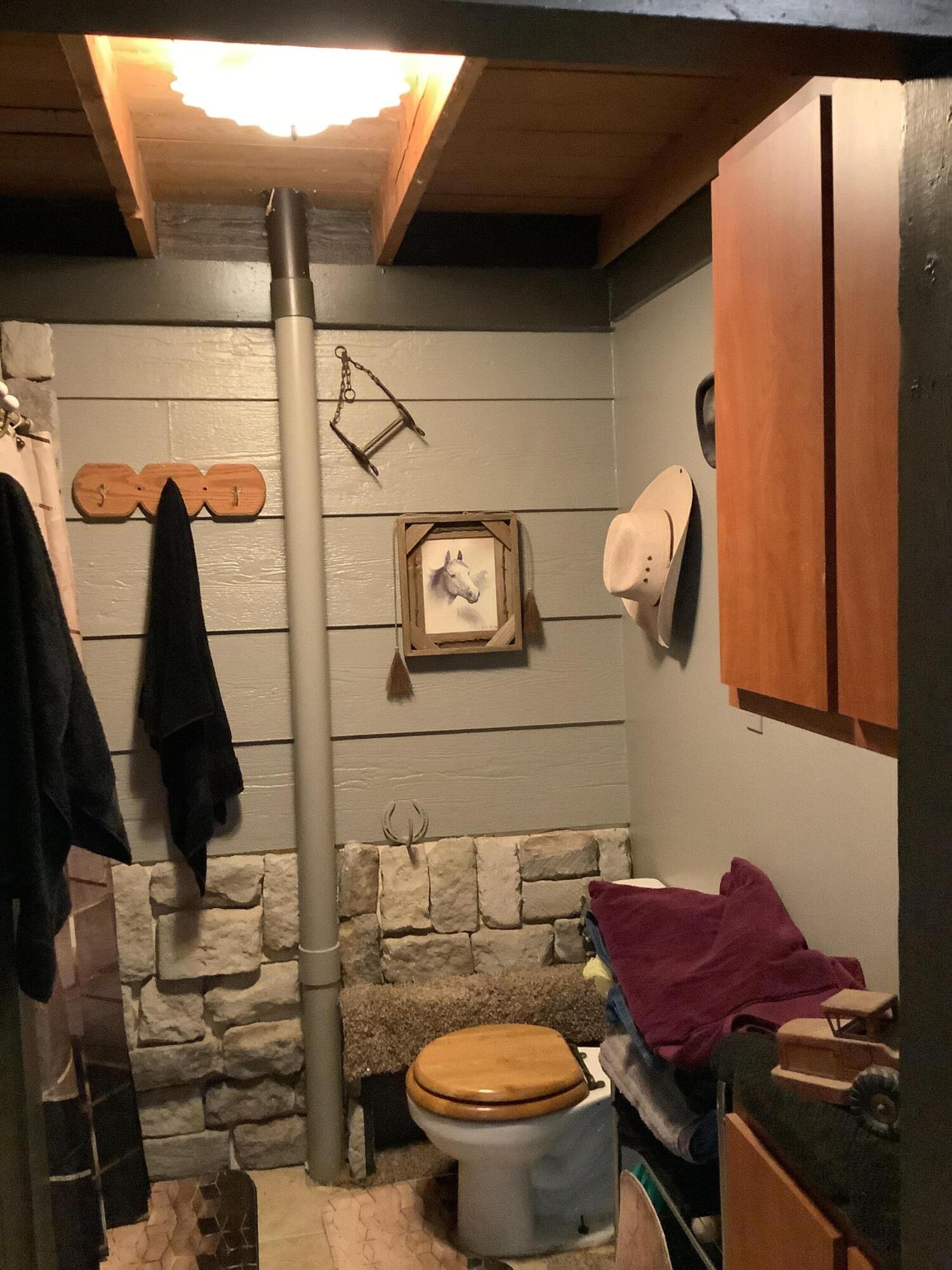 1203 South Date Plainview, TX 79072 - Photo 13 of 53 a bathroom with a toilet and a mirror