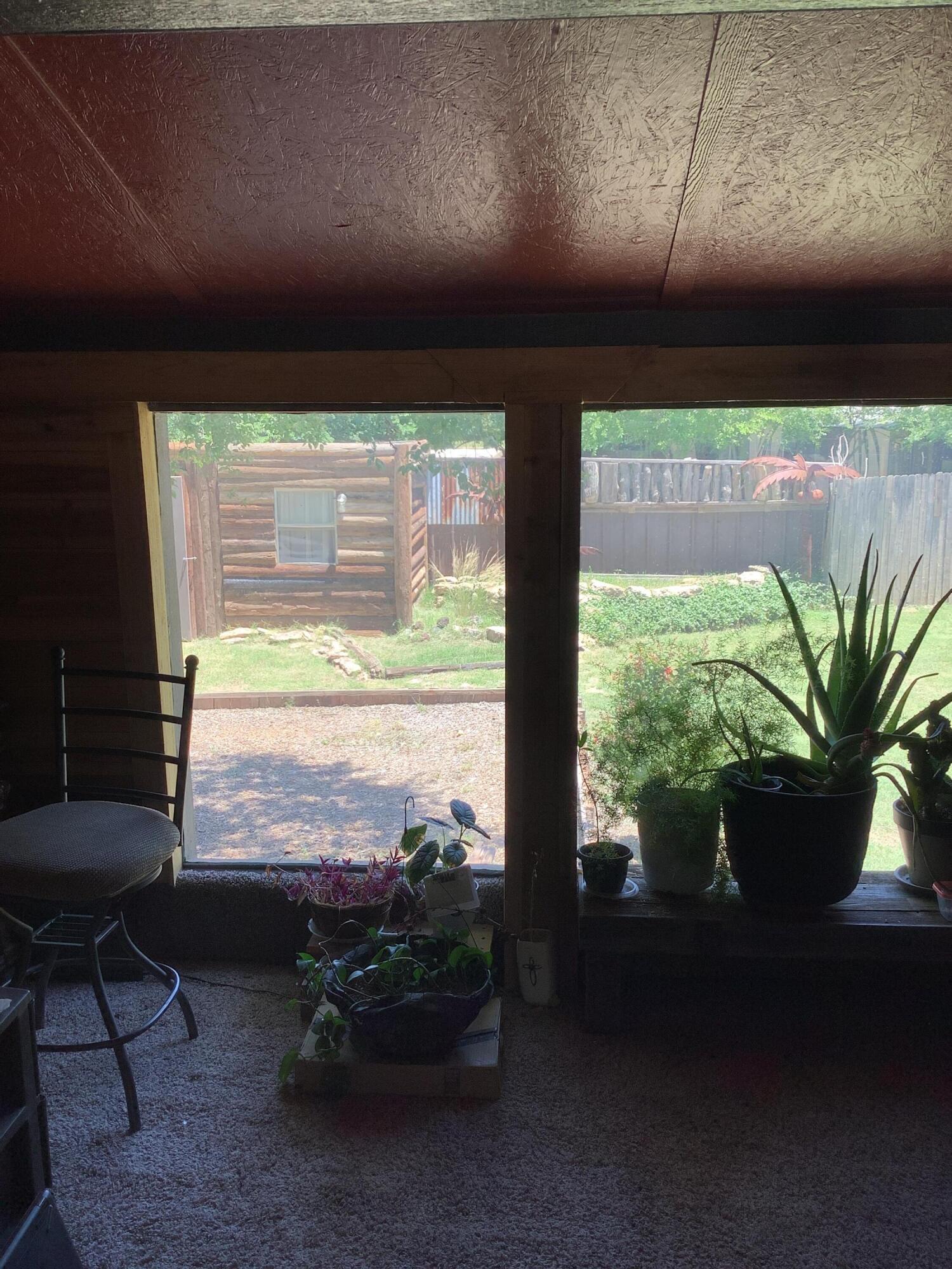 1203 South Date Plainview, TX 79072 - Photo 14 of 53 a room with furniture and a potted plant