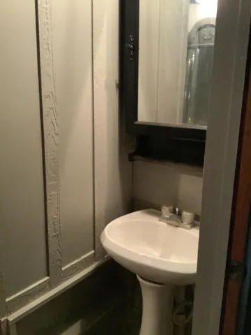 a bathroom with a sink and mirror