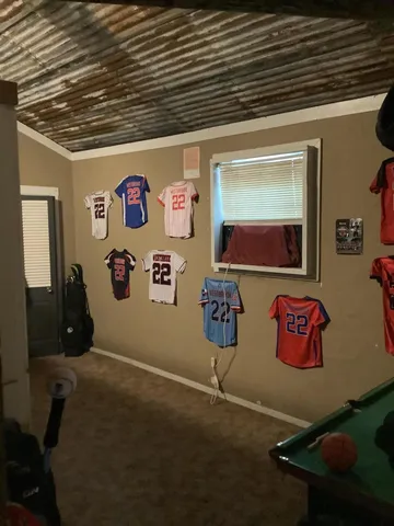 a hallway with table and chairs