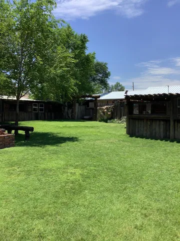 a view of a tables and chairs in patio