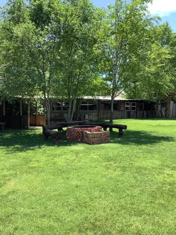 a view of a chairs and tables in patio