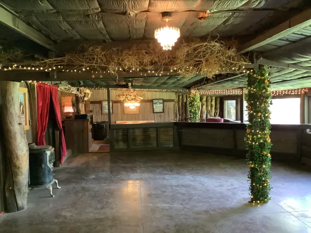 a view of a house with backyard porch and sitting area