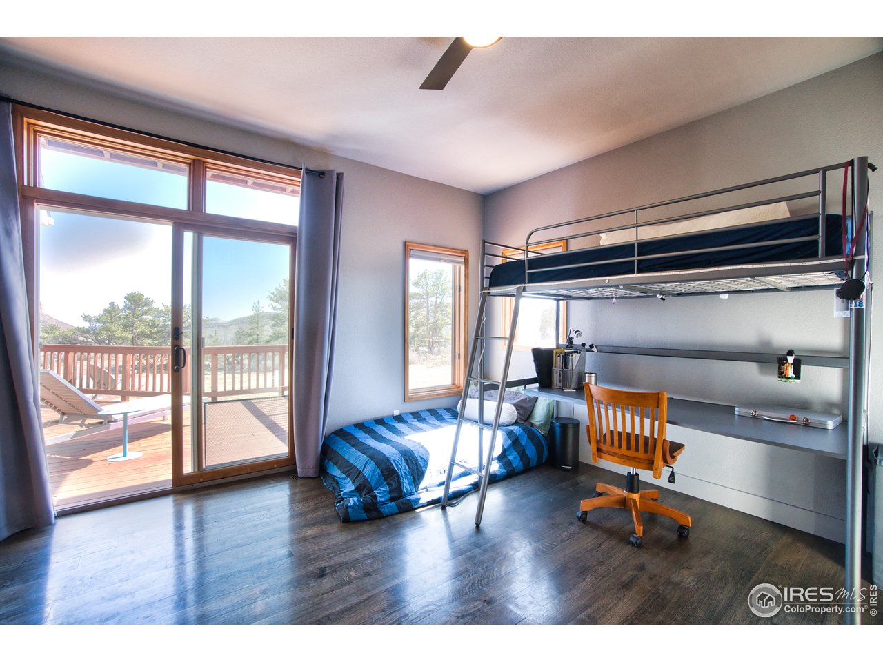700 Apple Ridge Road Lyons, CO 80540 - Photo 24 of 35 Main-level bedroom with deck access