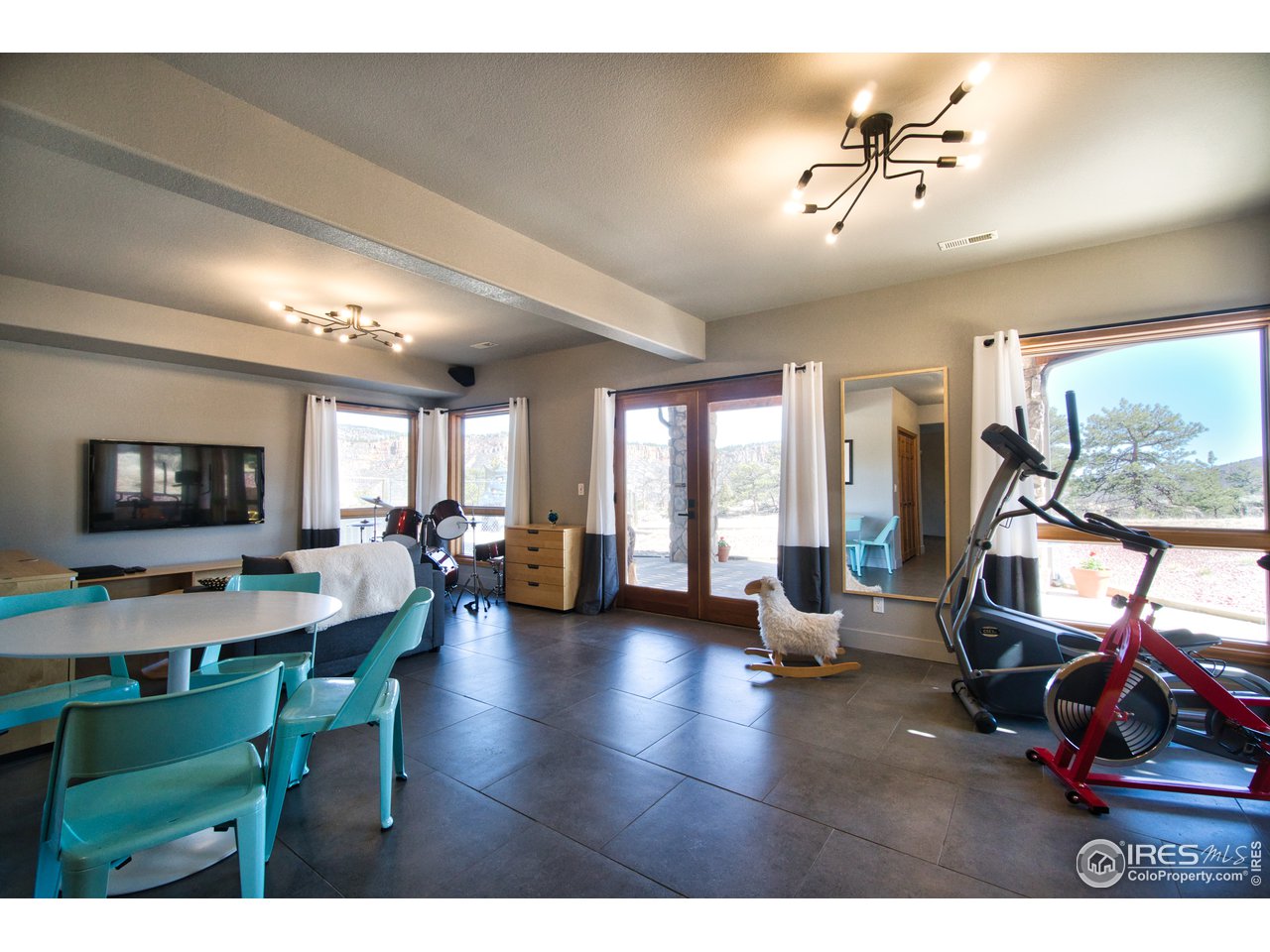 700 Apple Ridge Road Lyons, CO 80540 - Photo 29 of 35 Walk-out lower-level family room