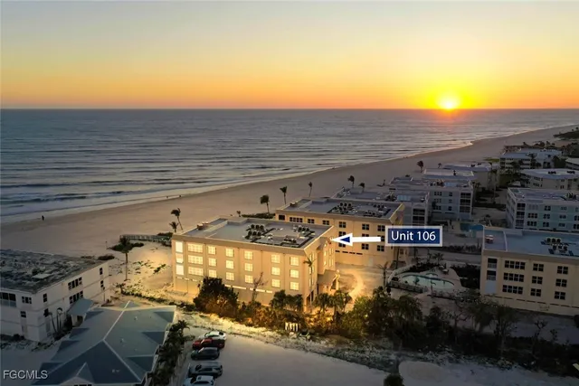 a view of a terrace with a table and chairs