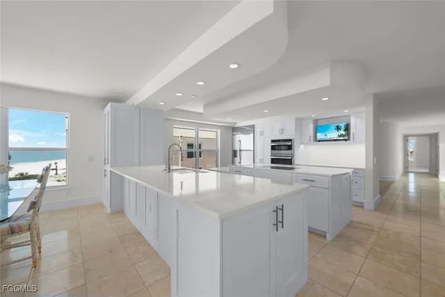 a kitchen with counter top space and stainless steel appliances