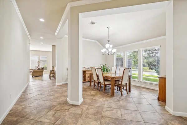 a view of a dining room with furniture window and outside view