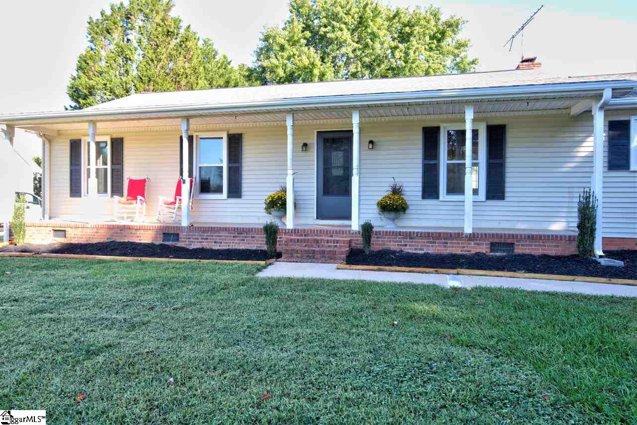 Enjoy almost an acre right off Woodruff Road and Hwy. 14