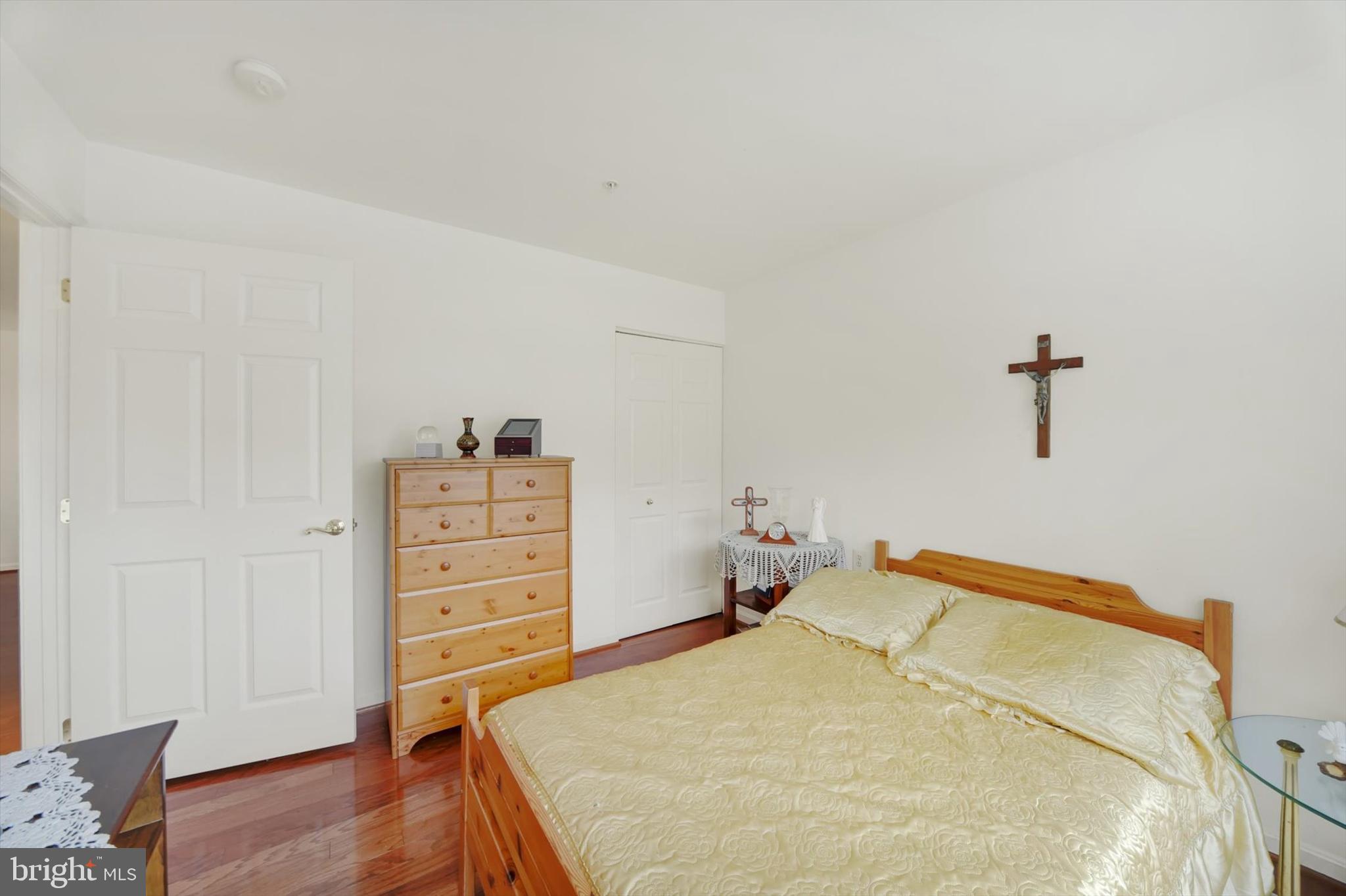 7419 Berryleaf Drive Laurel, MD 20707 - Photo 16 of 29 a bedroom with a bed and wooden floor